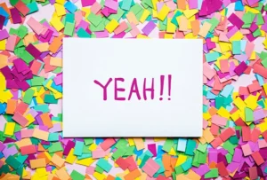Discount Sticky Notes. image shows assorted color sticky notes behind a large piece of paper that says 'yeah!!'
