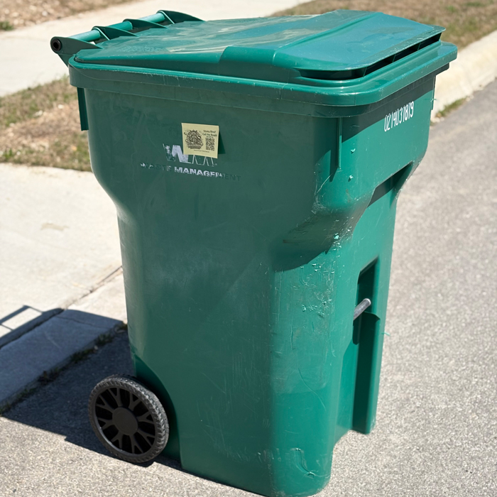 trash bin cleaning service advertisement on bin side