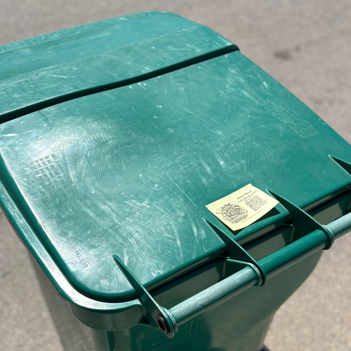 trash bin cleaning service advertisement on bin side