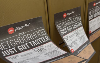 Pizza Hut Pizza Flyer Advertising on mailboxes blowing in the wind.